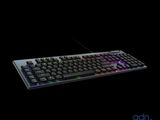 a computer keyboard that is lit up in the dark