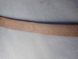 a close up of a piece of leather on a chair