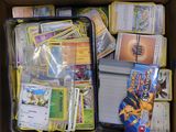 a box full of pokemon cards and cards in it