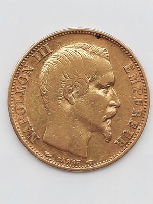 l'image d'une pièce d'or sur laquelle figure le visage d'un homme