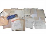 a pile of old papers and papers on a table