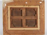 a close up of a wooden window with a rope on the side