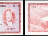 trois billets de banque différents, dont l'un porte l'effigie d'une femme