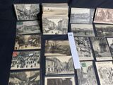 a lot of old postcards sitting on a table