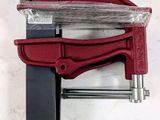 a close up of a clamp with a piece of plastic on top of it
