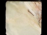 white marble block with a brown stripe on the top of it