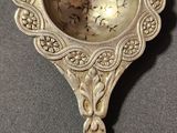 a silver spoon that is sitting on a table