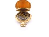an image of a pocket watch with a gold case on a white background