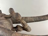 a statue of a man riding on the back of an elephant