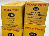 three boxes of dinky toys are stacked on top of each other