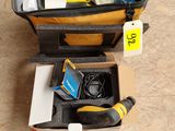 a suitcase with tools in it sitting on the floor