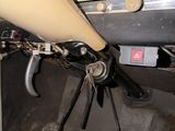 a close up of a car dashboard with a steering wheel
