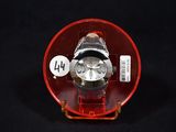 a watch sitting in a red case on a black surface