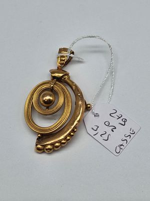a close up of a gold necklace with a tag on it