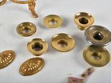 a lot of brass objects on a white table