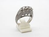 a close up of a silver ring on a white surface