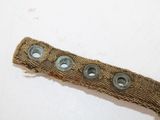a piece of cloth with buttons on it on a table