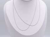 silver chain necklace on a mannequin display with a white background