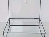 a glass box with a lid on a white surface