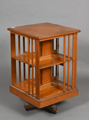 an antique wooden display case with shelves on wheels