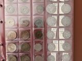a lot of coins in the case on the table