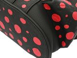 black and red polka dot travel bag on a white background