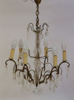a chandelier that has five lights attached to it