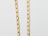 a close up of a chain on a white surface with a white background