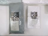 a bag of fabric next to a package of toilet paper