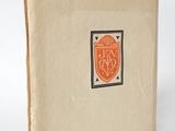 a close up of a book with a picture of a shield on it