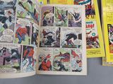 spider - man comics are spread out on a table in a comic book