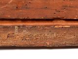 a close up of a piece of wood with holes in it