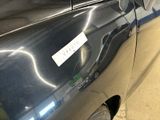 a car with a sticker on the side of it ' s door