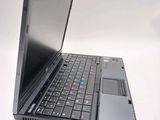 a laptop computer sitting on top of a white table