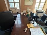 an image of a desk with a lot of papers on it