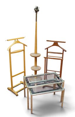 a glass table with a coat rack and a coat hanger on it