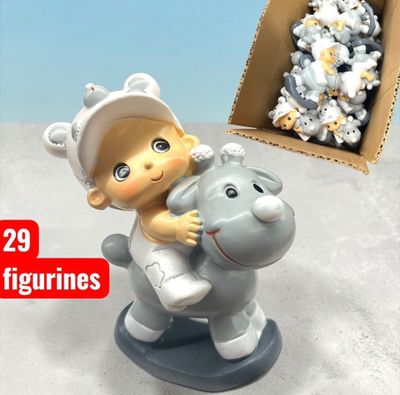 a small figurine of a baby riding a toy horse
