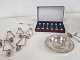 a silver plate with spoons and spoons and a silver plate with spoons and spoons