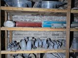 many pots and pans on the shelves in the room