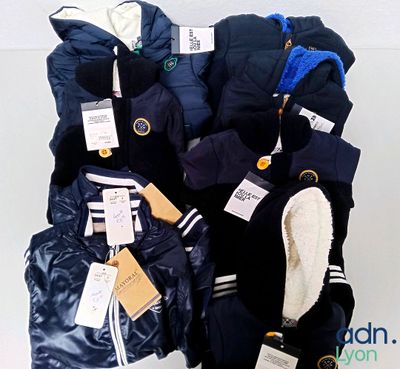 a pile of clothing that is on display on a table