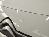 a close up of a car ' s front grill with a logo on it