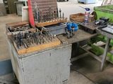 a workbench with many tools on it in a workshop