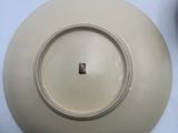 a white plate with a small square in the center