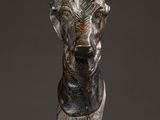 statue of an elephant on a stand on a marble surface