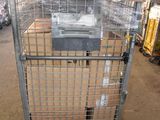 a metal cage with a printer in it in a warehouse