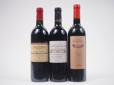 trois bouteilles de vin posées l'une à côté de l'autre sur une table