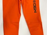 a pair of orange sweatpantss with black lettering on them