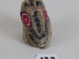 figurine of a rat with pink eyes and a number 21 on it