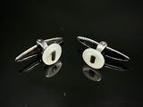 paire de boutons de manchette en argent avec des yeux en nacre