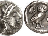a silver coin with an image of a bird on it